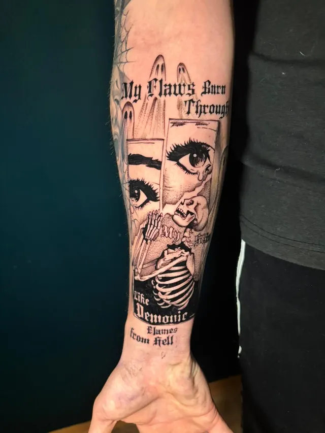 Forearm tattoo with blackletter lettering, eyes and a skeleton